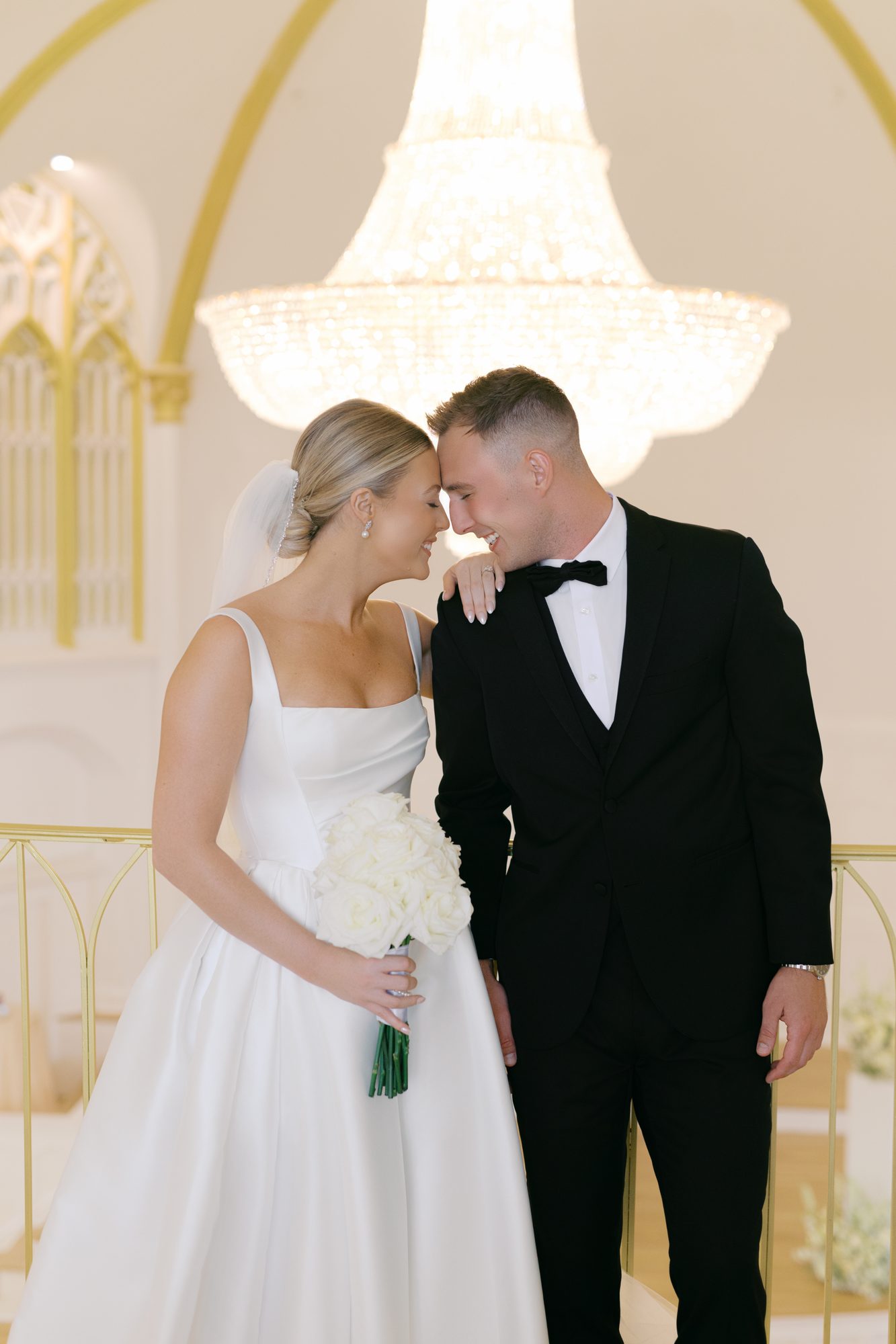 Editorial wedding portrait against the stained glass at Melrose Abbey