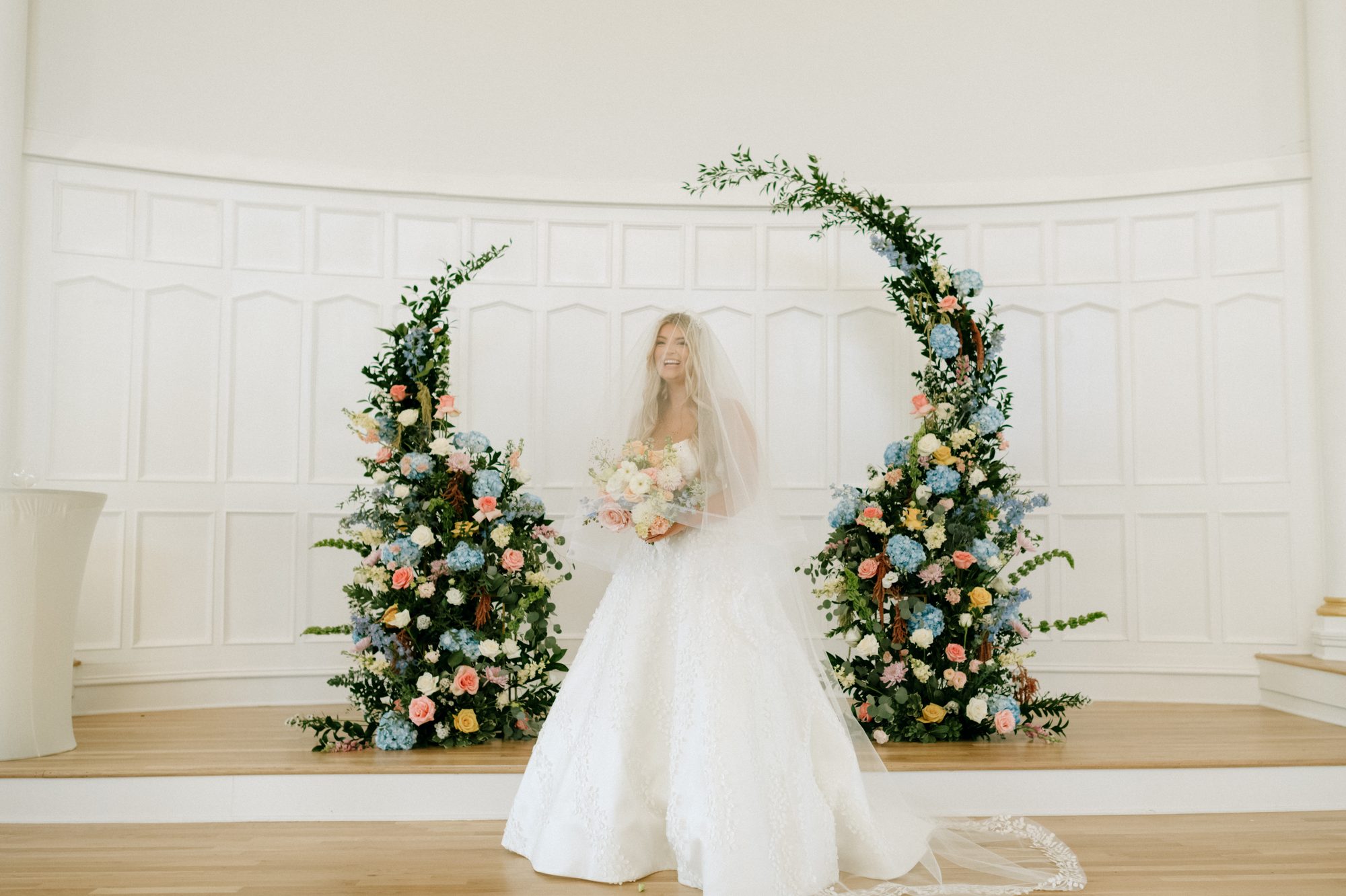 Editorial wedding portrait against the stained glass at Melrose Abbey